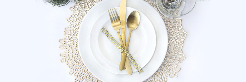 luxury table setting with gold silverware