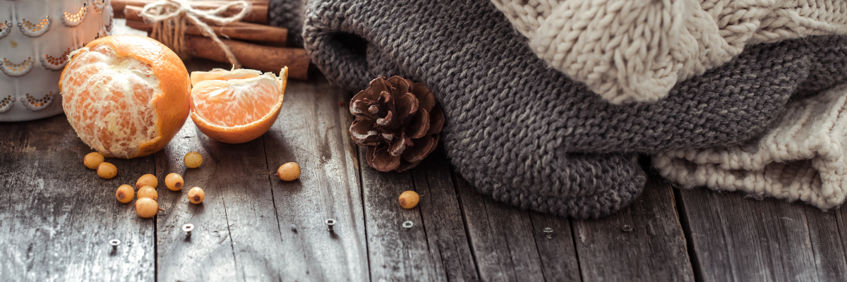 winter blanket with oranges and pinecones