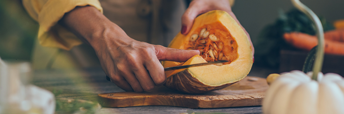 Man cutting a cantaloupe