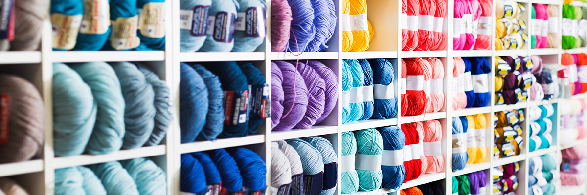 Shelves with various colors of yarn stacked
