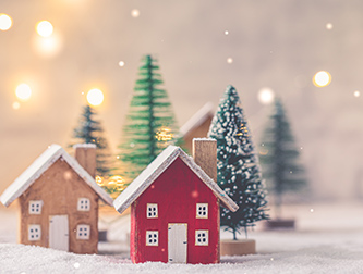 miniature home in snow setting