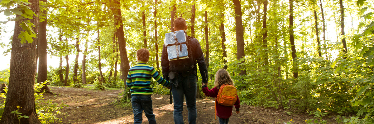 family going on hike in forest
