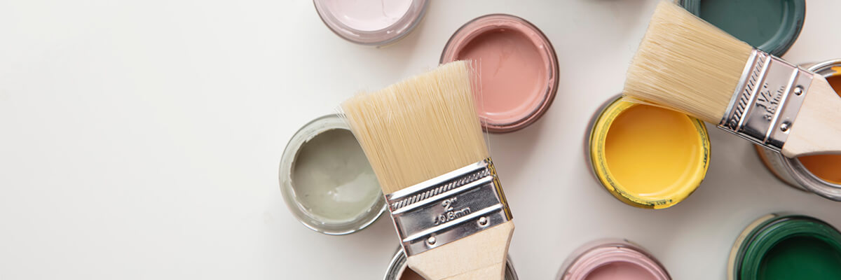 Paint brushes with open paint cans, design tips