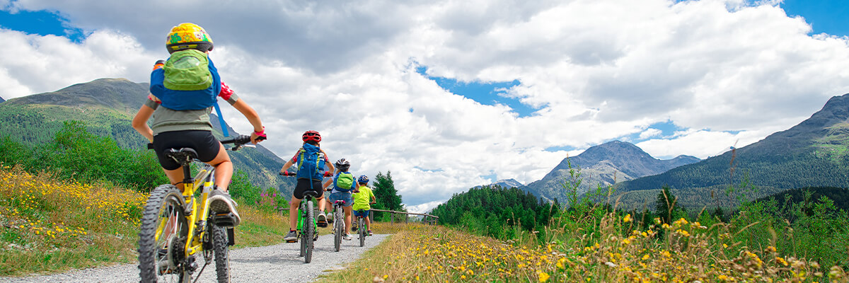 young kids on mountain bikes budget-friendly summer activities