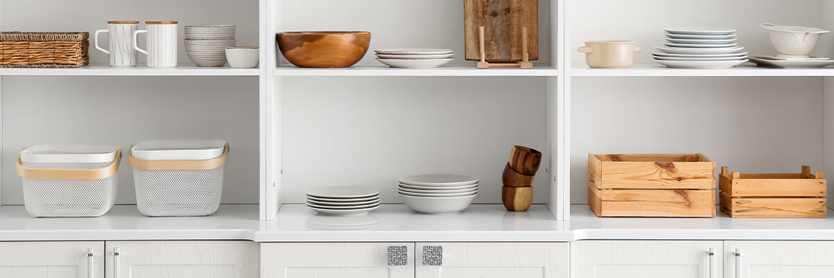 Kitchen shelves with plates cups and other kitchen items Organizing Your Home