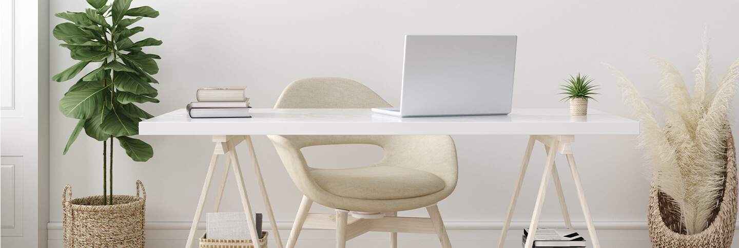 Office desk with white laptop, repurpose an extra bedroom